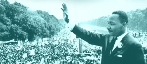 photo of martin luther king junior waving to a crowd during a speech | Honor Credit Union