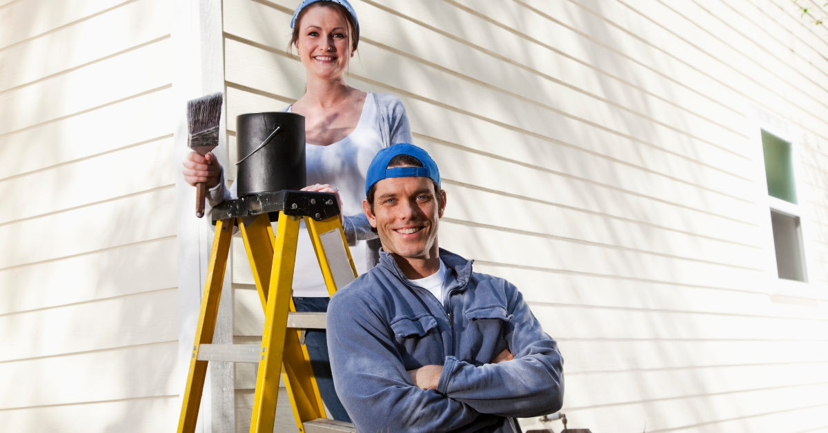 couple painting their house