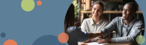 man and woman sitting at a table talking with a mortgage lender | Honor Credit Union