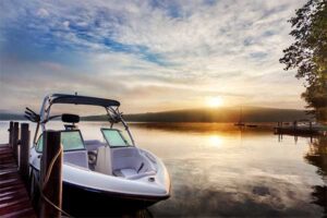 boat tied to a dock during a sunset | Honor Credit Union