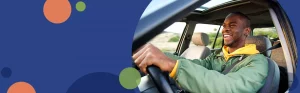 man smiling while driving a car | Honor Credit Union