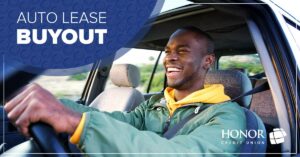 man smiling while driving a car | Honor Credit Union