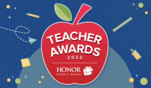 red apple with honor credit union teacher award promotional text on top of a blue background | Honor Credit Union