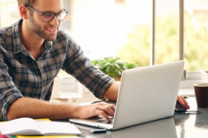 man looking at laptop | Honor Credit Union