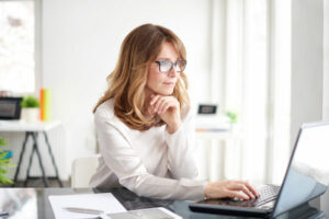 woman looking at a laptop screen | Honor Credit Union