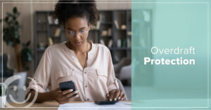 image featuring a photo of a woman looking at her phone | Honor Credit Union