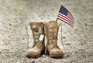 photo of military boots with an American flag sticking out of one of them | Honor Credit Union