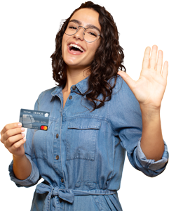woman in blue jean dress holding an honor credit card while smiling