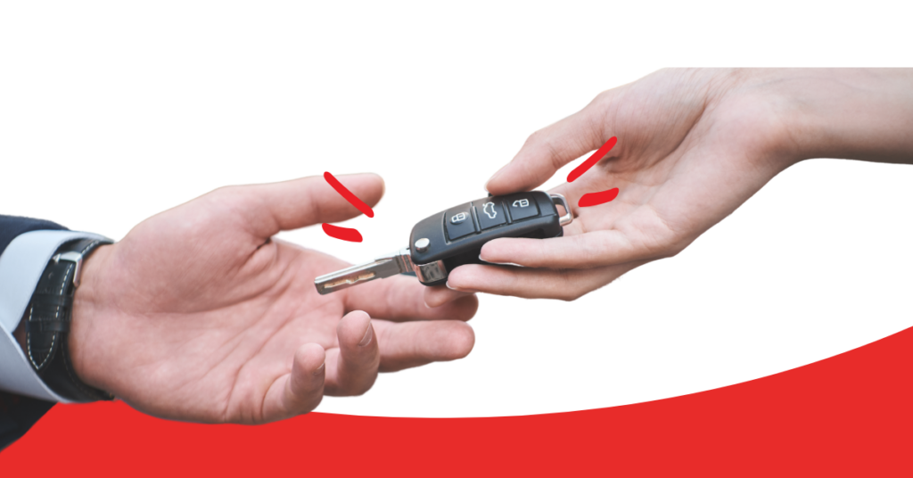 two hands passing car keys to each other