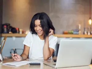 woman doing accounting work at a desk | Honor Credit Union