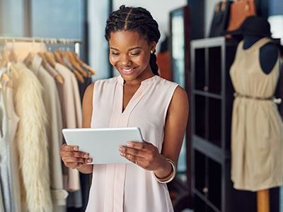 female business owner looking at a tablet device