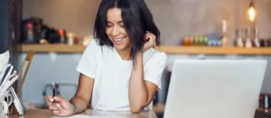 woman doing accounting work at a desk | Honor Credit Union