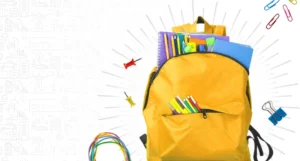 yellow backpack with school supplies overflowing | Honor Credit Union