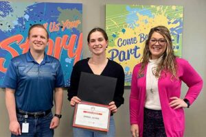 honor team members presenting a scholarship to a high school senior | Honor Credit Union