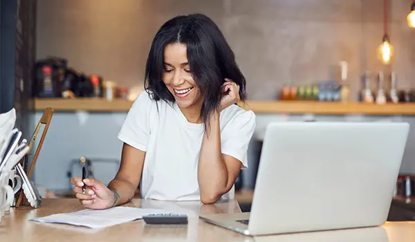 businesswoman looking at paperwork at a desk