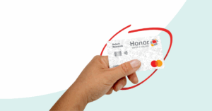 hand holding a Honor Select Rewards credit card with a red circle around it | Honor Credit Union