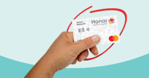 hand holding a Honor Select Rewards credit card with a red circle around it | Honor Credit Union