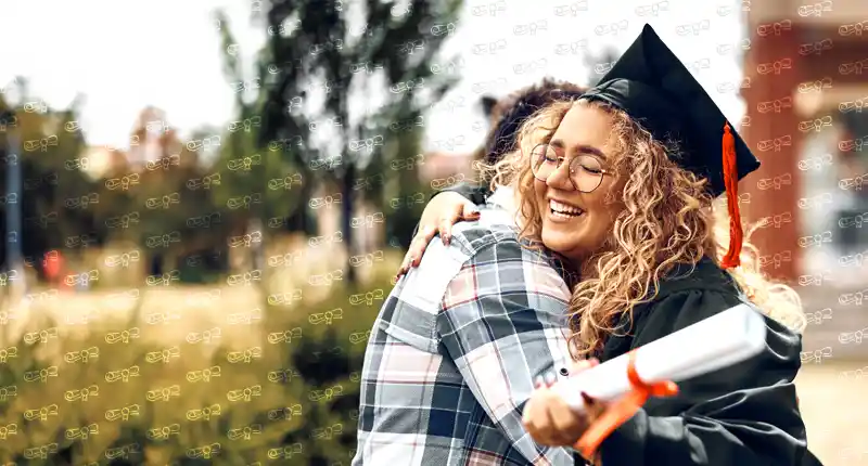 graduate getting a hug