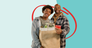 father and son grocery shopping with their Honor debit card using debit card round up | Honor Credit Union