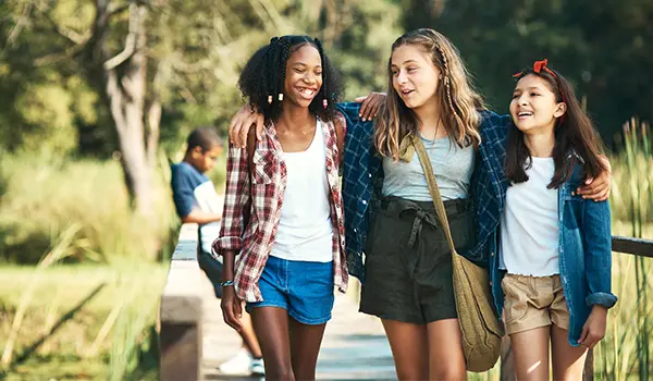 group of girls smiling and laughing outside