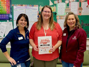 teacher award winner with honor team members | Honor Credit Union