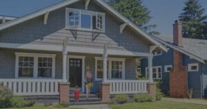 woman and child walking up porch steps to a house | Honor Credit Union
