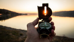 hand holding a compass | Honor Credit Union