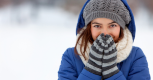 women in snow attire that is cold | Honor Credit Union