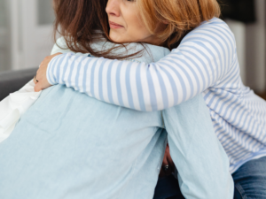 two women hugging | Honor Credit Union