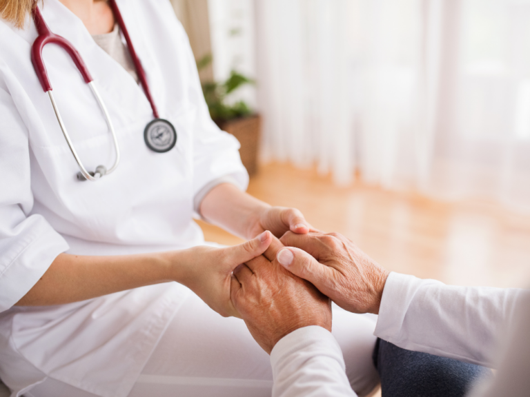 doctor holding a patient's hands