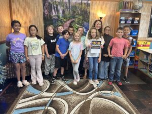 teacher awards winner April Denisiuk of Calhoun Christian School with her class | Honor Credit Union