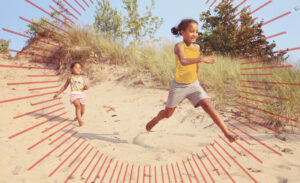 two young girls running at the beach | Honor Credit Union