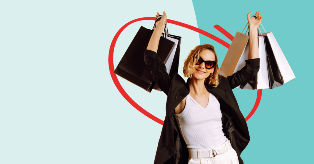 women holding up shopping bags smiling, because she just scored black Friday deals