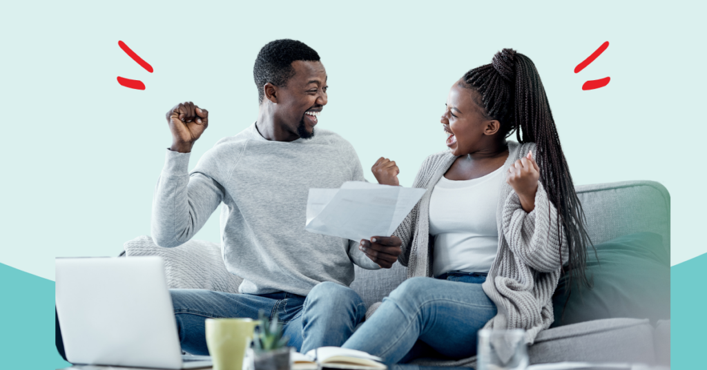 young couple exclaiming with excitement with their fists in the air that they took control of their debt