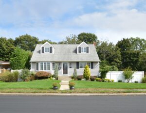 beige house with a nice front yard | Honor Credit Union