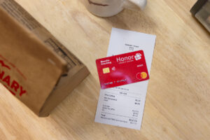 Trenary Toast Cafe receipt with an Honor debit card on top | Honor Credit Union