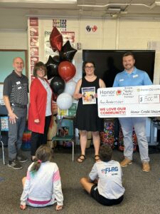 Teacher Awards Winner Ann Armbruster from Portage Public Schools with Honor team members: Mark Hancock, Kimberly Nower, Thomas Hatfield | Honor Credit Union