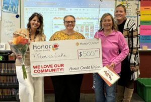 winner of teacher awards Monica Luke from Buchanan Middle School with Christy Layman, Honor Buchanan Member Center Manager, Karol Behrle, Honor Community Development Officer, and Principal Shelby Beasley | Honor Credit Union