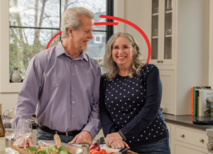 couple in a kitchen together smiling | Honor Credit Union