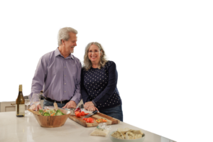 husband and wife preparing food in a kitchen | Honor Credit Union