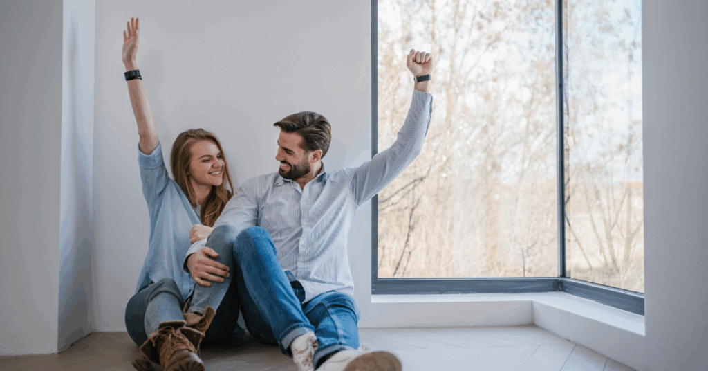 couple excited they paid their mortgage off early