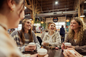 group of girls drinking Infusco Coffee at The Market in St. Joseph, MI | Honor Credit Union