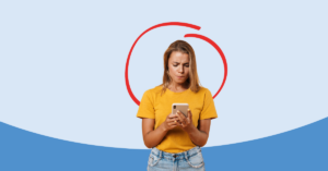 women looking at her cell phone concerned | Honor Credit Union