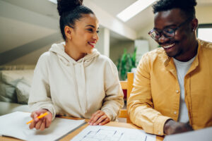 couple looking at house plans | Honor Credit Union
