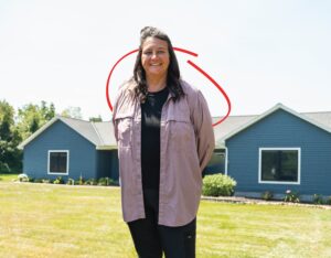 homeowner in front of her new house | Honor Credit Union