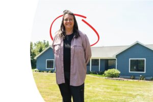 homeowner in front of her new house | Honor Credit Union