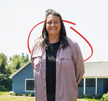 Julie, Honor member in front of her home