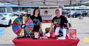 Honor Credit Union staff at an event table | Honor Credit Union