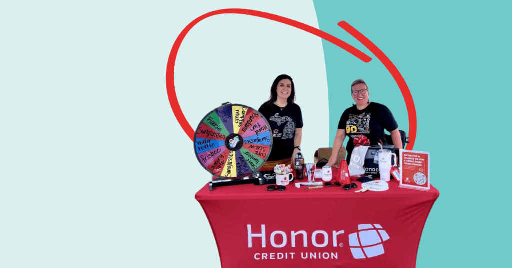 Honor Credit Union staff at an event table