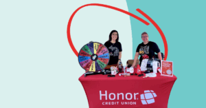 Honor Credit Union staff at an event table | Honor Credit Union